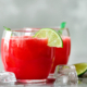 Glass of fresh watermelon juice with lime, mint, ice